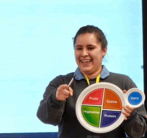 Instructor holding a plate